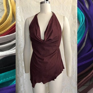 May include: A maroon halter top with a cowl neck and a asymmetrical hemline. The top is made of a soft, stretchy fabric.