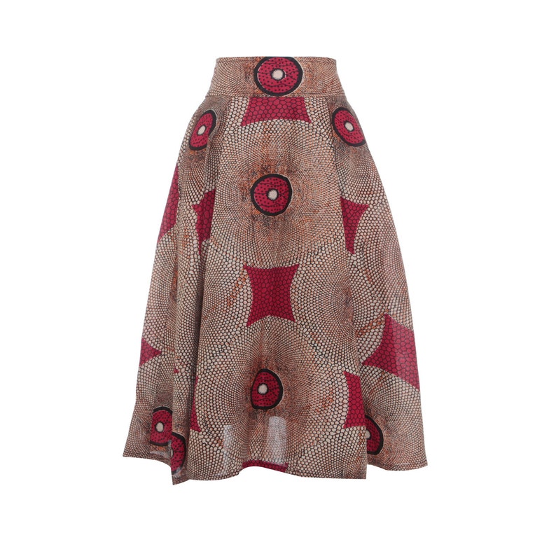 May include: A brown and red printed skirt with a circle pattern. The skirt has a high waist and a flared silhouette.