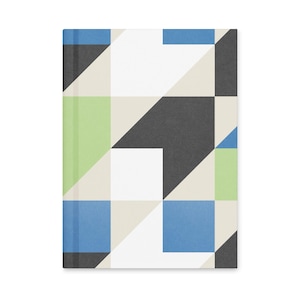 May include: A hardcover notebook with a geometric design. The cover features a pattern of blue, green, black, white, and beige shapes. The notebook is rectangular and has a clean, modern aesthetic.
