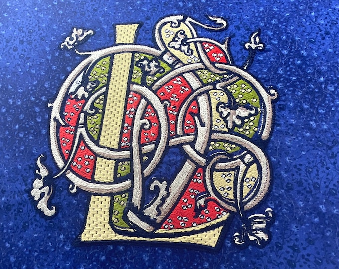 Illuminated Letter "L" Embroidered on to Fabric