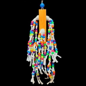 May include: A colorful beaded bird toy with a wooden dowel and white string. The beads are in various colors, including pink, blue, green, yellow, and orange.