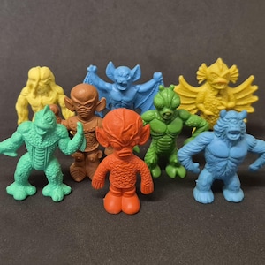 Vintage Rubber Uglies Monster – Red/yellow Jiggler, Sprue Attached
