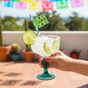 Fiesta-themed biodegradable paper straws, featuring papel picado–style flags printed with festive phrases: HOLA, FIESTA, OLÉ, and SALUD! Colorful striped paper straws,