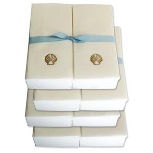 Nature&#39;s Linen Disposable Guest Hand Towels Wrapped with a Ribbon - Embossed with a Shell