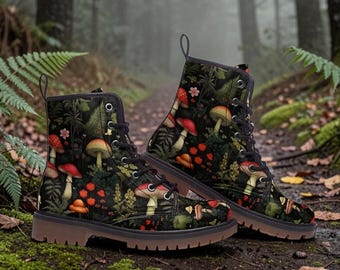 May include: A pair of combat boots with a whimsical mushroom pattern. The boots feature a dark background with red, orange, and white mushrooms, green foliage, and black laces. The soles are brown, and the boots are set on a forest path.