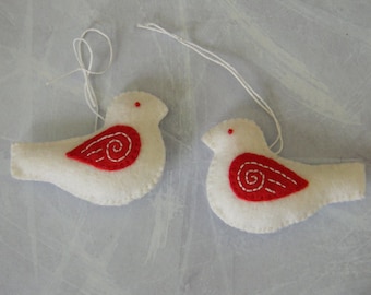 Set of two hand embroidered white and red bird ornaments