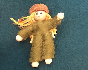 Mini elf bendable doll dressed in fern green with an acorn hat