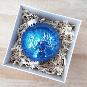 Large 4 Personalized Baby's First Christmas Ornament gift with calligraphy, baby boy gift One Blue Glitter Plastic Ball Bauble image 1