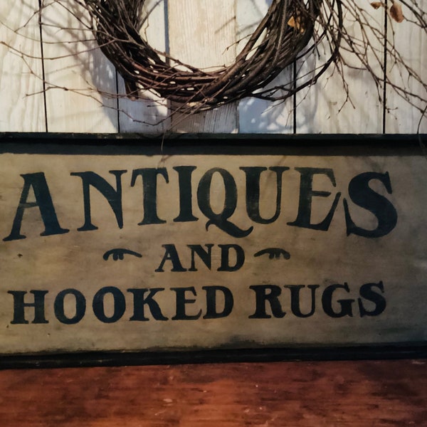 Antiques and hooked rugs sign