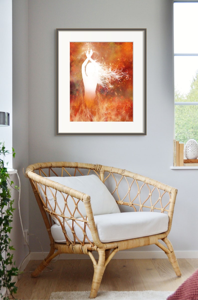 Framed print featuring illustration of a woman rising from flames