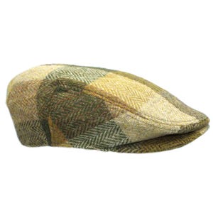 May include: A green, yellow and brown tweed flat cap with a herringbone pattern.