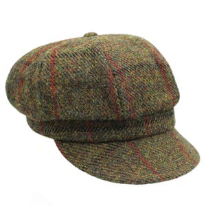 May include: A green, red and black tweed newsboy cap with a slightly curved brim.
