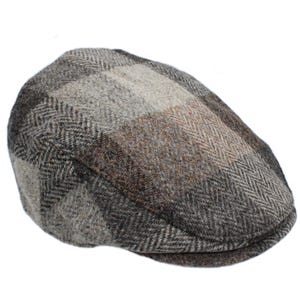May include: A tweed flat cap in a patchwork design. The cap features a mix of brown, gray, and tan hues. The fabric has a herringbone weave pattern. The cap is a classic style, suitable for various occasions.