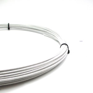 May include: A roll of white wire, secured with a black cable tie. The wire is coiled and ready for use in crafting or jewellery making.