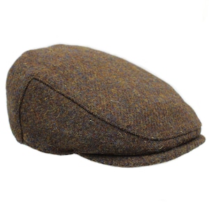 May include: A brown tweed flat cap with a slightly curved brim.