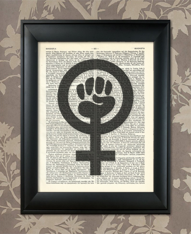 May include: A black and white feminist symbol with a raised fist in the center, superimposed on a page of text from a vintage book. The text is in Greek and is partially obscured by the symbol.