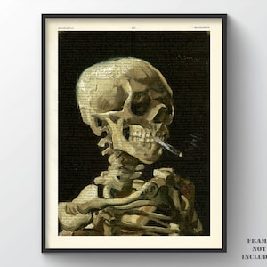 May include: A vintage-style print of a human skull with a cigarette in its mouth. The skull is painted in a realistic style with a textured background. The print is framed in black.