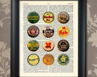 May include: A vintage dictionary page with various beer bottle caps arranged on top. The caps are from different brands, including Altbrau, Nut Brown Ale, Blue Bear Ale, Ballantine Export, Burgie, Boh Beer, Sager Bond Street Beer, Lucky Lager, Wielands Lager Beer, Kessler Beer, Black Hawk Oklahoma, and GB Bavarian Lager.