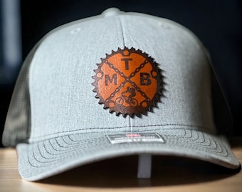Mountain Biking Trucker Hat: Laser Engraved Leather Patch
