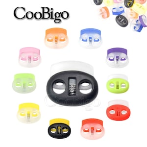 Può includere: Assortimento di blocca-corda in plastica colorati con meccanismo a molla. I blocca-corda sono disponibili in nero, bianco, rosso, arancione, giallo, verde, blu, viola e rosa.