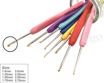 May include: A set of 8 colorful crochet hooks in a glass jar. The hooks are made of metal with gold tips and have a rubber grip. The sizes of the hooks are 1.0mm, 1.25mm, 1.50mm, 1.75mm, 2.0mm, 2.25mm, 2.50mm, and 2.75mm.