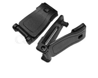 May include: Two black plastic buckle clips for straps or belts. The clips have a locking mechanism and are designed for securing straps or belts.