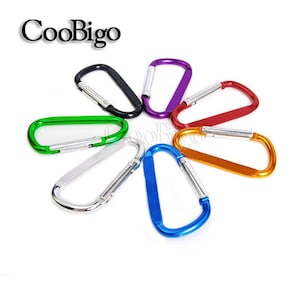 May include: A collection of colorful carabiner clips in various colors, including black, purple, red, orange, green, silver, and blue. The word "CooBigo" is printed in black above the clips.