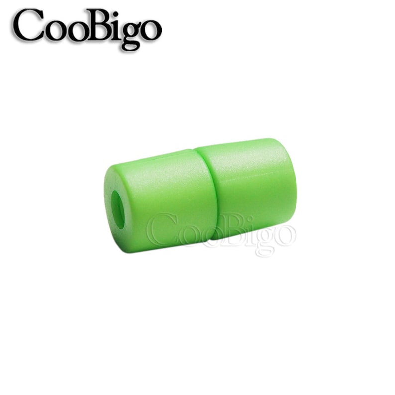 May include: A green plastic cord end stop with a hole in the centre. The cord end stop is designed to prevent cords from fraying.