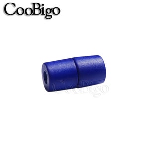 May include: A close-up of a blue plastic cord end stop. The end stop is designed to prevent cords from fraying.