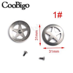 May include: Two silver metal star-shaped embellishments with a 31 mm diameter. Each embellishment has a five-pointed star cut out in the center. The embellishments are shown with two silver metal rivets.