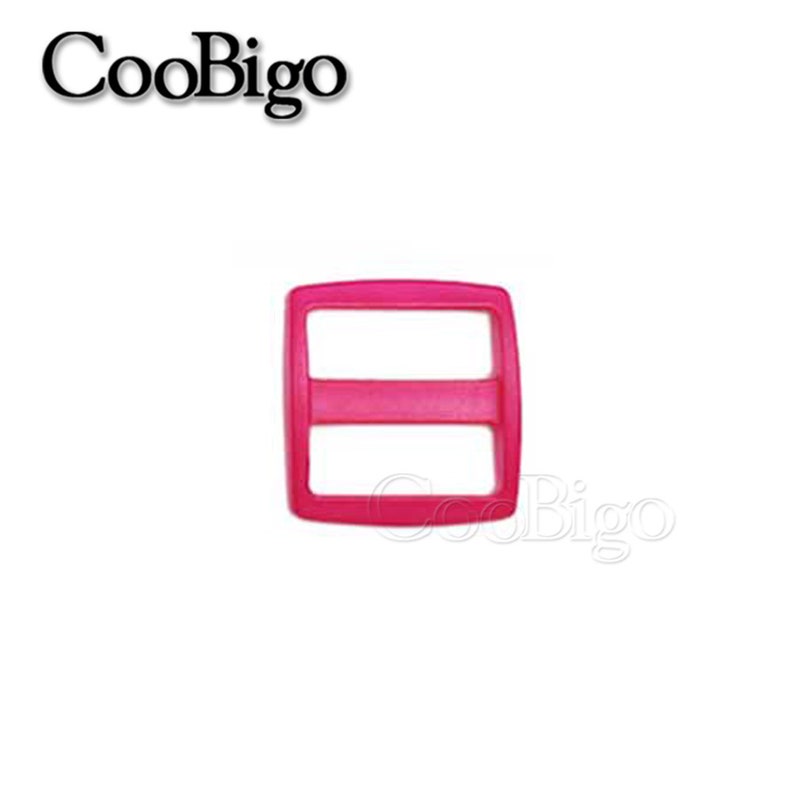 May include: A bright pink plastic slider buckle with two horizontal bars. The buckle is a common accessory for straps, bags, and clothing.
