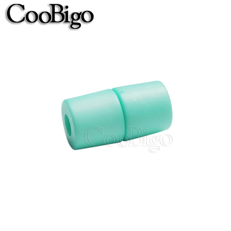 May include: A light green plastic cord end stop. The end stop is a cylinder with a hole in the centre. It is designed to prevent cords from fraying.