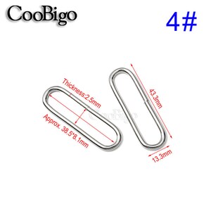 May include: Two silver-colored, oval-shaped metal rings. The rings are approximately 38.5mm x 8.1mm, with a thickness of 2.5mm. The rings are labeled with the text "CooBigo" and the number "4#".