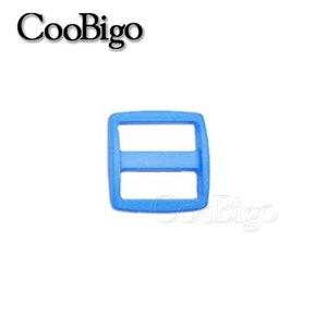 May include: A light blue plastic slider buckle. The buckle has two holes and is designed to be used with webbing or straps.