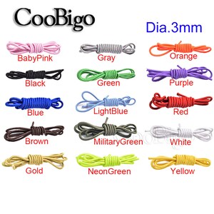 Peut inclure: Assortiment de 12 couleurs de lacets &eacute;lastiques de 3 mm. Les couleurs comprennent le rose p&acirc;le, le gris, l'orange, le noir, le vert, le violet, le bleu, le bleu clair, le rouge, le marron, le vert militaire, le blanc, l'or, le vert n&eacute;on et le jaune.