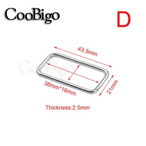 May include: A silver-colored rectangular metal buckle with dimensions of 43.5mm x 21mm and a thickness of 2.5mm. The buckle has a rectangular opening of 38mm x 16mm. The word "D" is in red in the upper right corner.