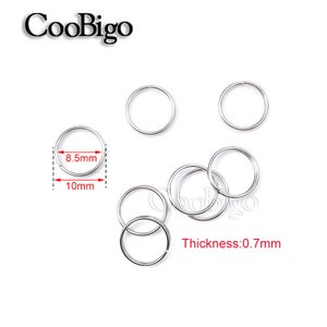 May include: Silver jump rings, 10mm in diameter and 8.5mm in width, with a thickness of 0.7mm. CooBigo is printed on the image.