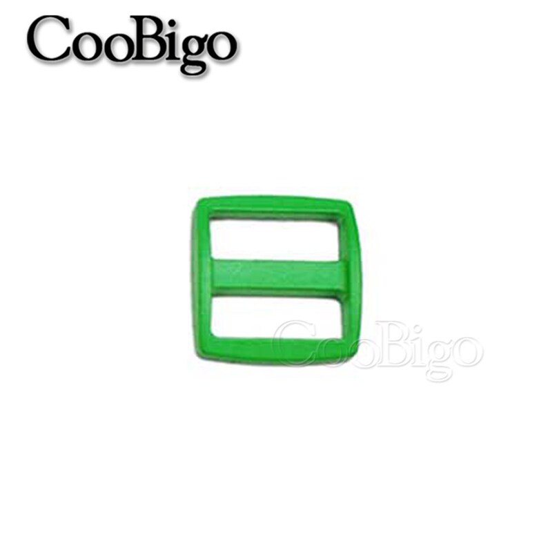 May include: A bright green plastic slider buckle with two slots. The buckle is a common hardware component used for straps, bags, and other DIY projects.