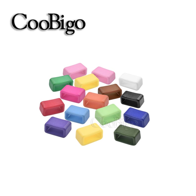 May include: Assortment of 16 colorful plastic slider buckles. The buckles are rectangular with a small opening in the center. The colors include red, green, blue, yellow, orange, pink, purple, brown, black, white, and light blue.