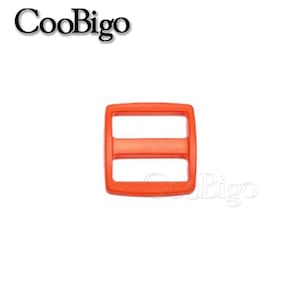 May include: Orange plastic slider buckle with two slots. The buckle is a common hardware component used for straps, bags, and other DIY projects.
