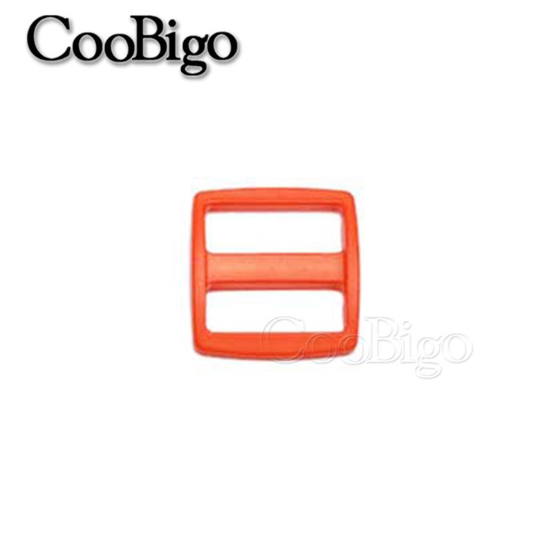 May include: Orange plastic slider buckle with two slots. The buckle is a common hardware component used for straps, bags, and other DIY projects.