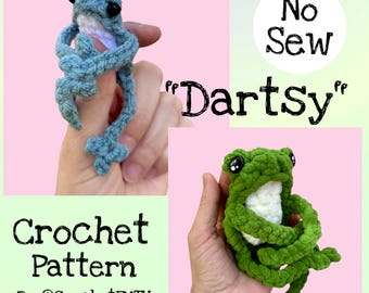 May include: Crochet pattern featuring two handmade frog plushies in blue and green. The text "No Sew" and "Dartsy" are displayed. The words "Crochet Pattern" and the creator's handle are also visible.