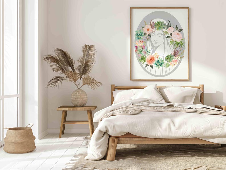 May include: A white bed with a white and brown striped blanket and two white pillows. A framed print of a woman's face surrounded by flowers hangs on the wall above the bed.