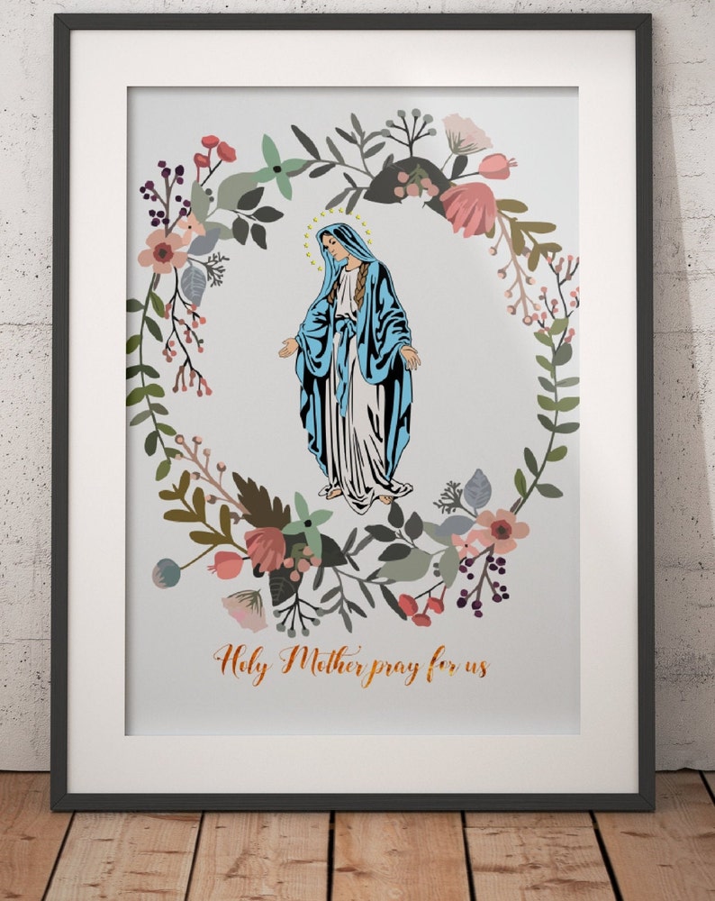 May include: A framed print with a floral wreath surrounding a depiction of the Virgin Mary. The text "Holy Mother pray for us" is printed below the image.
