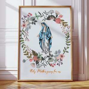 May include: A printable art print featuring a floral wreath with a depiction of the Virgin Mary in the center. The text "Holy Mother pray for us" is printed below the image.