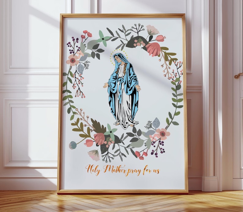 May include: A printable art print featuring a floral wreath with a depiction of the Virgin Mary in the center. The text "Holy Mother pray for us" is printed below the image.