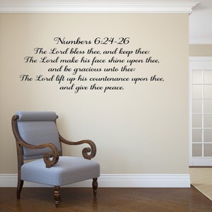 May include: A black wall decal featuring the text Numbers 6:24-26, The Lord bless thee, and keep thee: The Lord make his face shine upon thee, and be gracious unto thee: The Lord lift up his countenance upon thee, and give thee peace.