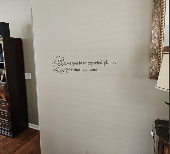 Life takes you to unexpected places. Love brings you home. Vinyl wall decal.