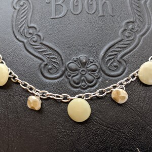 Antique button dangle bracelet.