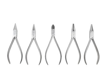 May include: Five silver-toned jewellery pliers with black handles. The pliers are arranged in a row from left to right. Each plier has a different shape at the end of the jaws. The pliers are labelled "WT TOOLS".